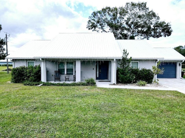 ranch-style home featuring a porch, a garage, and a front lawn