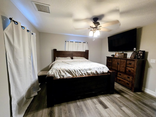 bedroom with ceiling fan and light wood-type flooring