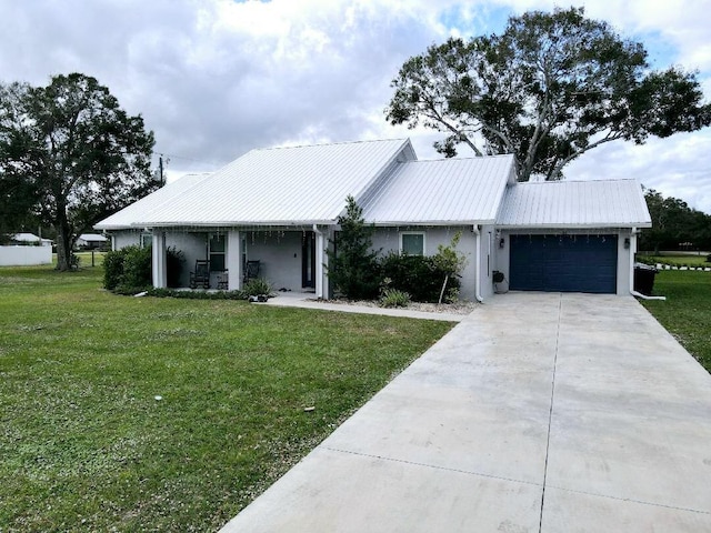 single story home featuring a front yard and a garage