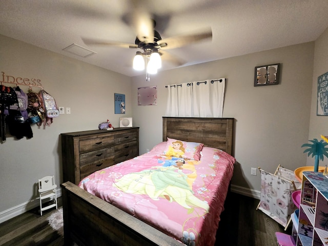 bedroom featuring ceiling fan and dark wood-type flooring