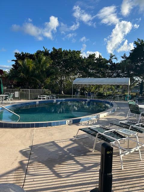 view of swimming pool with a patio