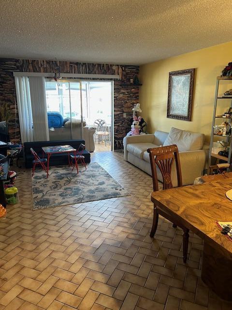 living room featuring a textured ceiling