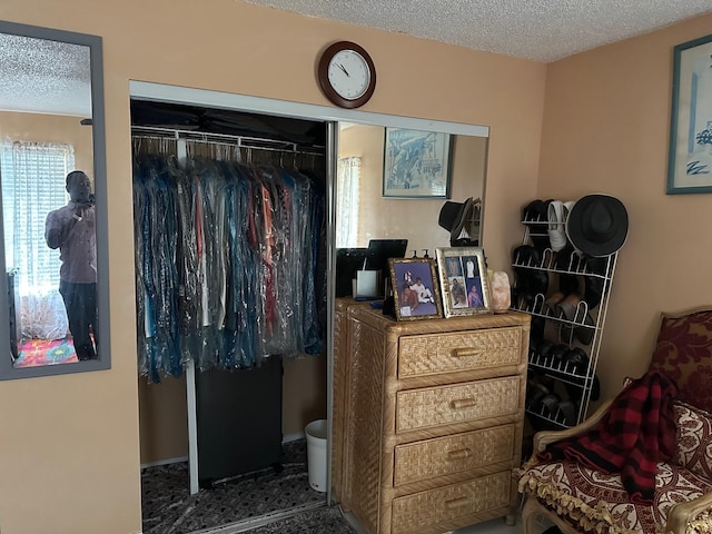 bedroom featuring a closet and a textured ceiling