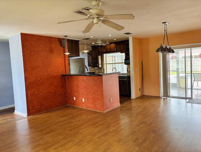 kitchen with dark brown cabinetry, stainless steel refrigerator, ceiling fan, and dark wood-type flooring