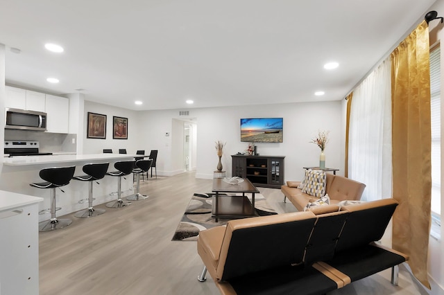 living room with light hardwood / wood-style floors