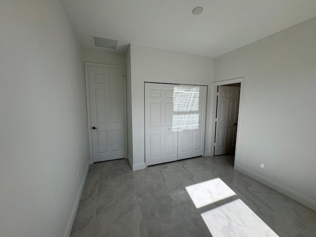 unfurnished bedroom featuring a closet