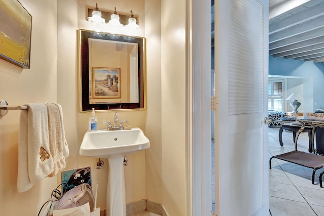 bathroom featuring sink and tile patterned flooring