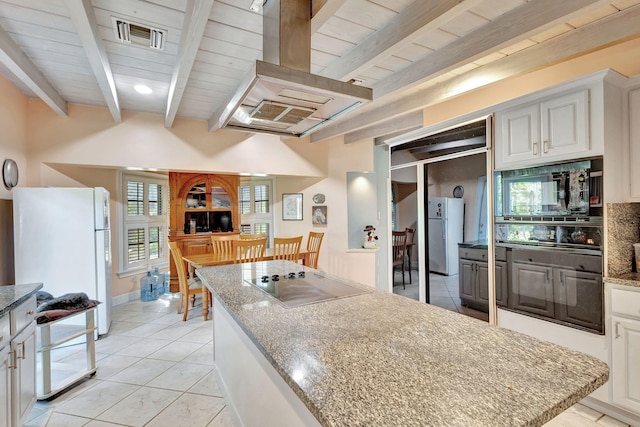 kitchen featuring white cabinets, island range hood, light stone counters, and black appliances