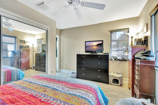 bedroom featuring ceiling fan and light hardwood / wood-style flooring