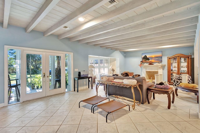 tiled living room with beam ceiling and french doors