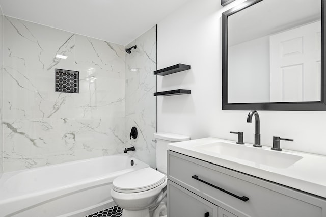 full bathroom with tiled shower / bath, vanity, and toilet