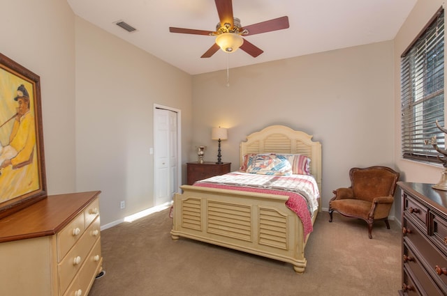 bedroom with dark colored carpet and ceiling fan