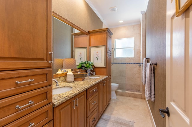 bathroom with walk in shower, tile patterned floors, toilet, crown molding, and vanity