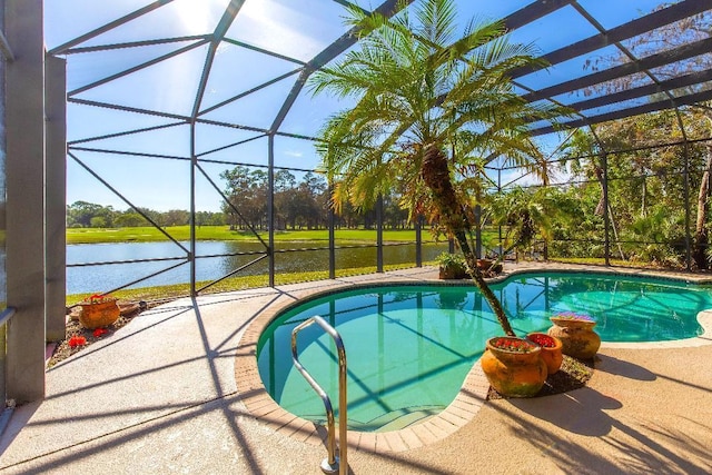 view of pool with a water view, a patio area, and a lanai