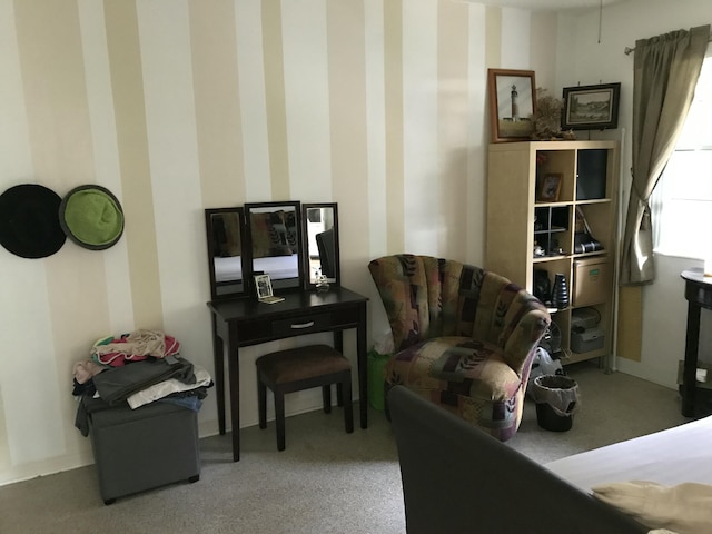 sitting room featuring carpet flooring