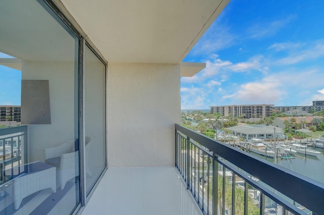 balcony featuring a water view