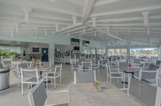 dining room with lofted ceiling with beams