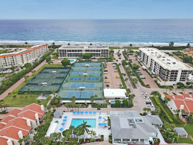 birds eye view of property featuring a view of the beach and a water view