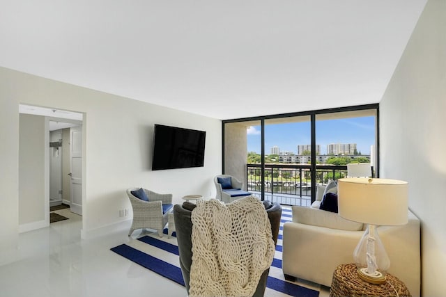 living room featuring floor to ceiling windows