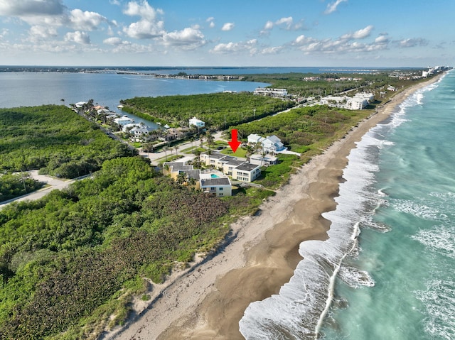 aerial view featuring a water view and a beach view