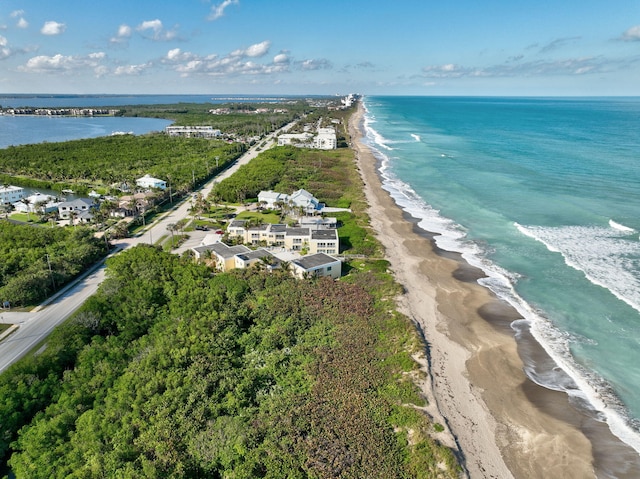 aerial view featuring a water view and a beach view