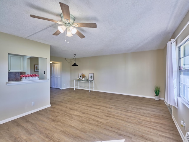 empty room featuring hardwood / wood-style floors and a textured ceiling