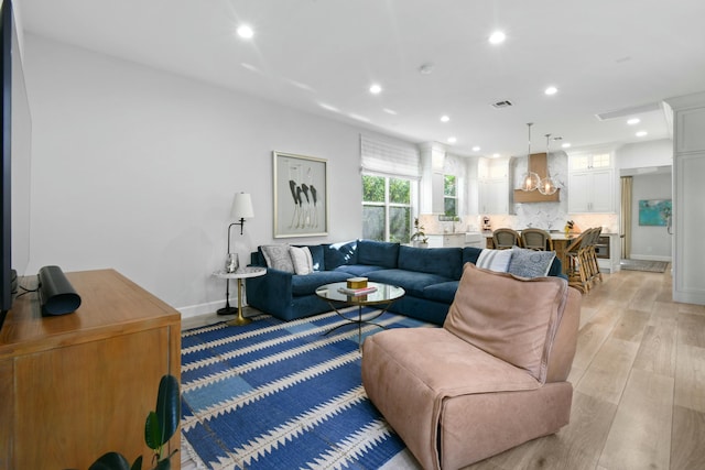 living room with light hardwood / wood-style flooring