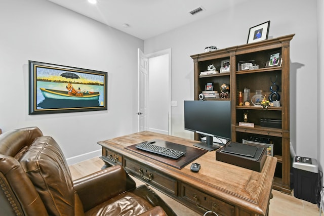 office area with light wood-type flooring