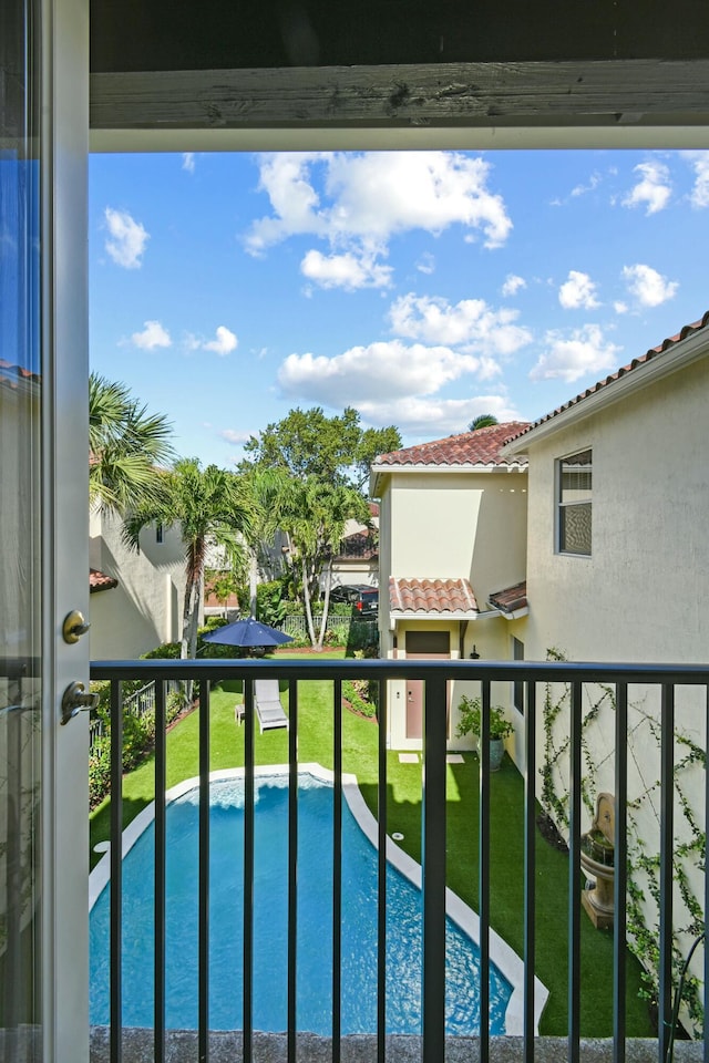 view of pool featuring a yard