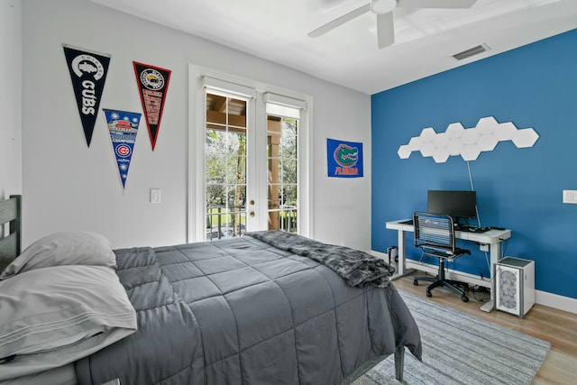 bedroom featuring access to outside, ceiling fan, and light wood-type flooring