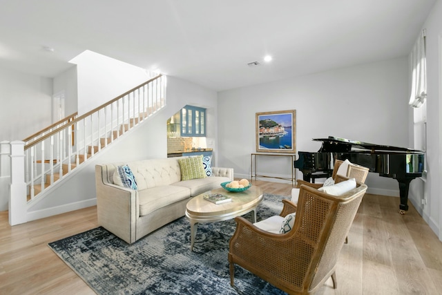 living room with light hardwood / wood-style flooring