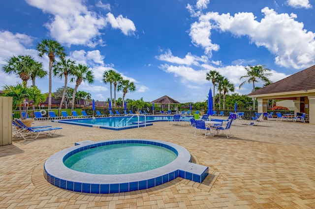 view of swimming pool with a gazebo and a patio area