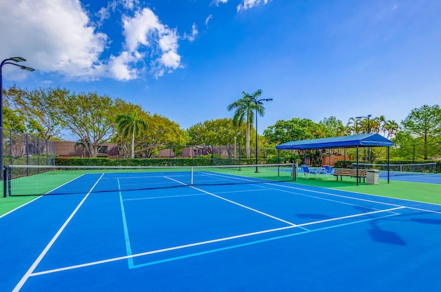 view of tennis court with basketball court