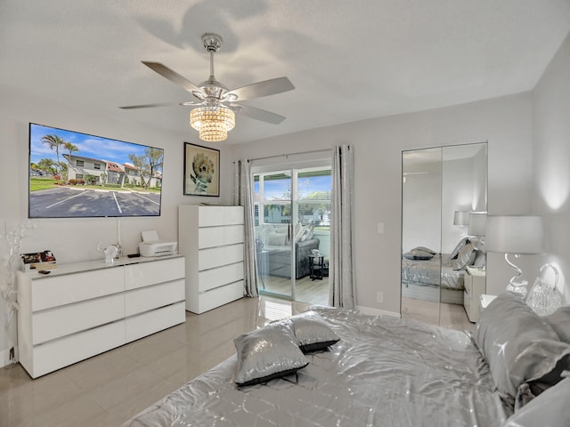 tiled bedroom featuring ceiling fan