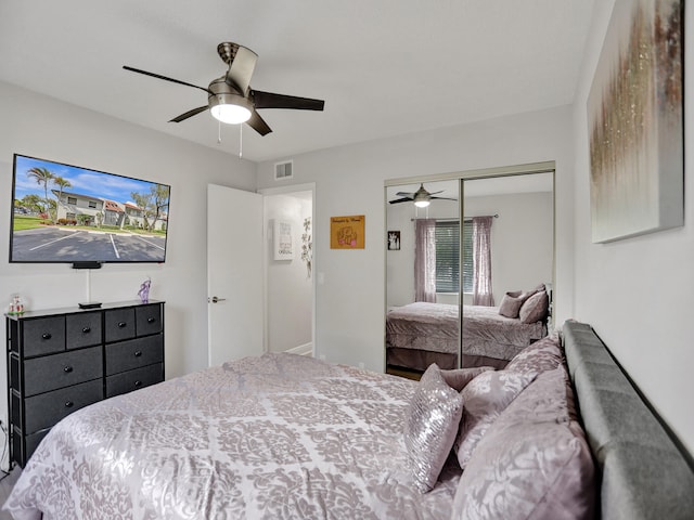 bedroom with ceiling fan and a closet