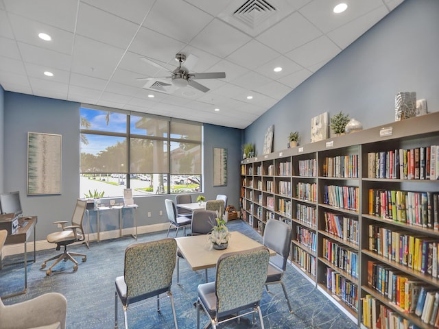 interior space featuring a paneled ceiling and ceiling fan