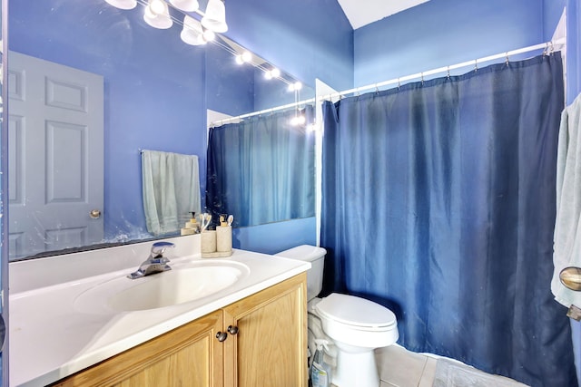 bathroom with tile patterned floors, vanity, and toilet