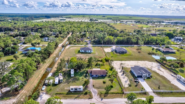 drone / aerial view featuring a rural view and a water view