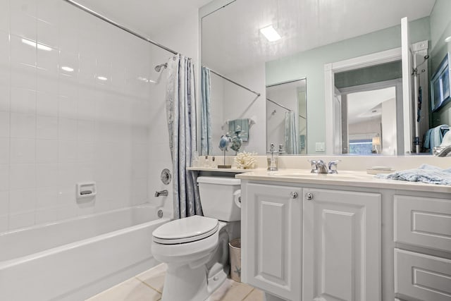 full bathroom featuring vanity, shower / bath combo with shower curtain, tile patterned flooring, and toilet