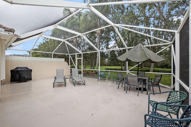 view of patio / terrace with a lanai