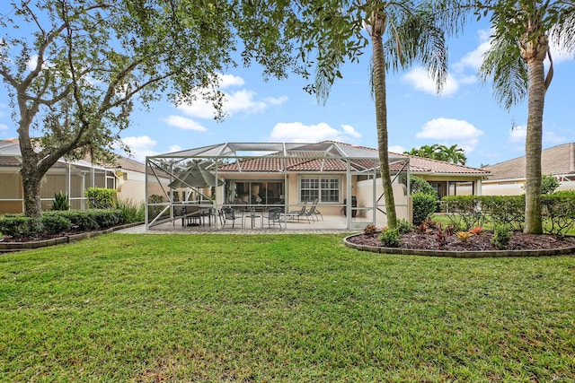 rear view of house with a patio area, a lanai, and a yard