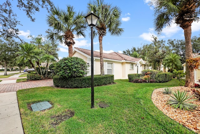 view of property exterior featuring a lawn