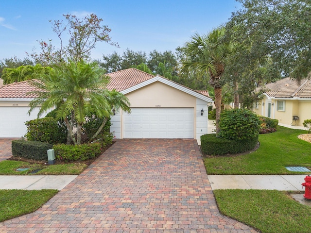 view of front facade with a front lawn and a garage