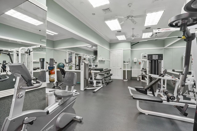 gym featuring ceiling fan and crown molding