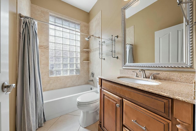 full bathroom featuring tile patterned flooring, vanity, shower / tub combo with curtain, and toilet