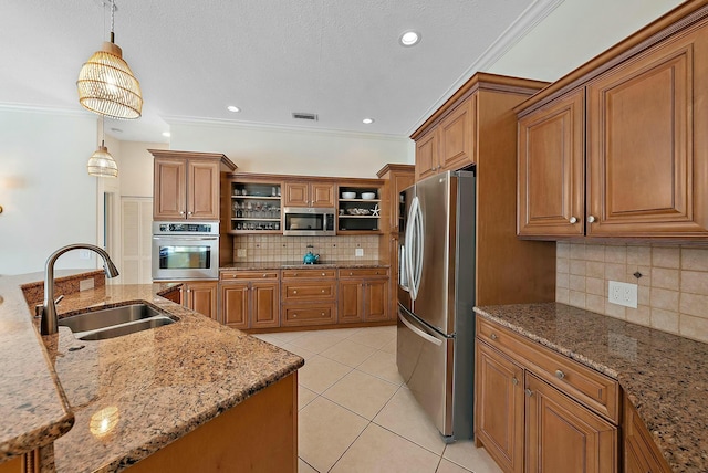 kitchen with brown cabinets, open shelves, visible vents, appliances with stainless steel finishes, and a sink