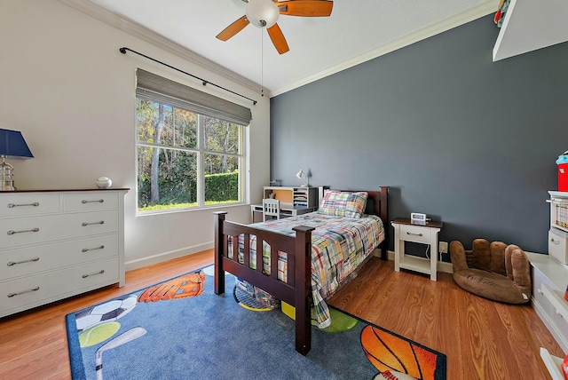 bedroom with ceiling fan, light hardwood / wood-style flooring, and ornamental molding