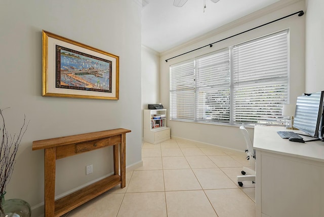 office space with light tile patterned floors and crown molding