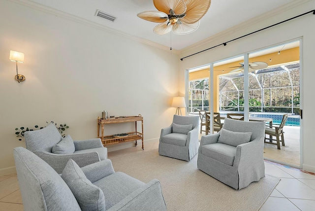 living room featuring light tile patterned flooring and ornamental molding