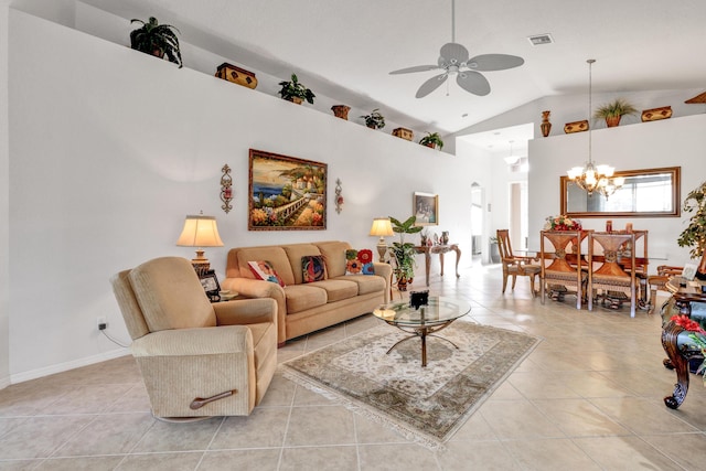 living room featuring ceiling fan with notable chandelier, light tile patterned floors, and lofted ceiling